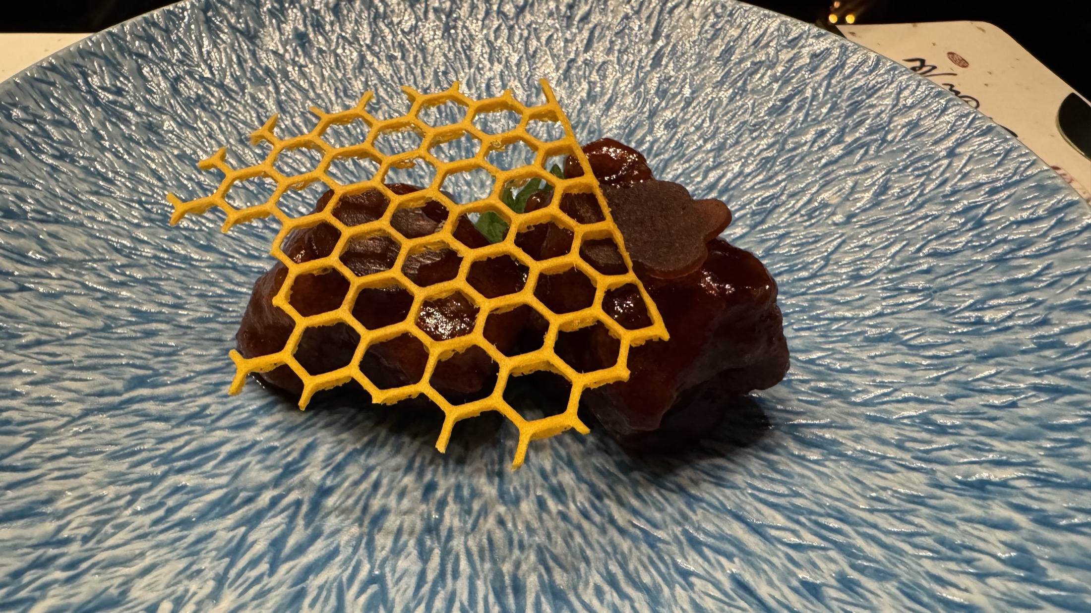 Honeycomb dessert on a blue textured plate