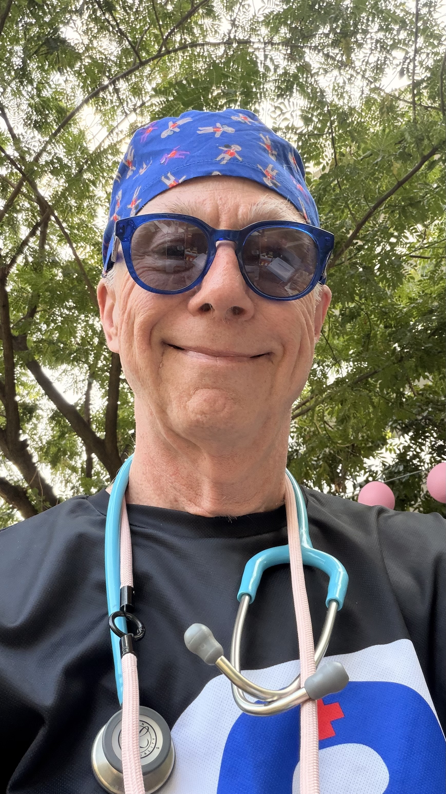 Dr John Walker in work attire with a stethoscope